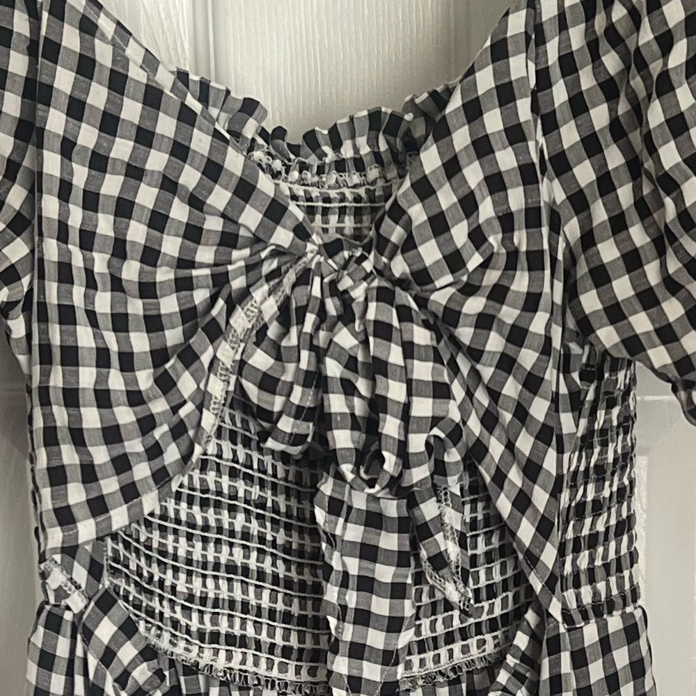 Large , can adjust by tying bow in back.